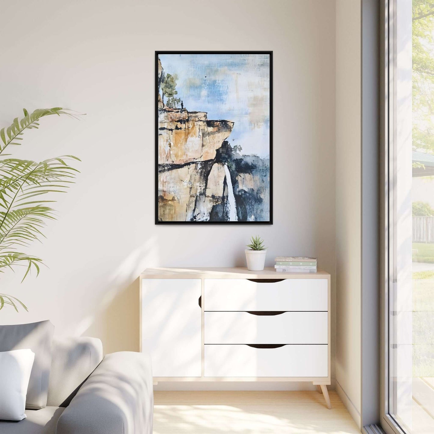 Impressionistic scenic landscape waterfall framed canvas wall art in modern living room with natural lighting.