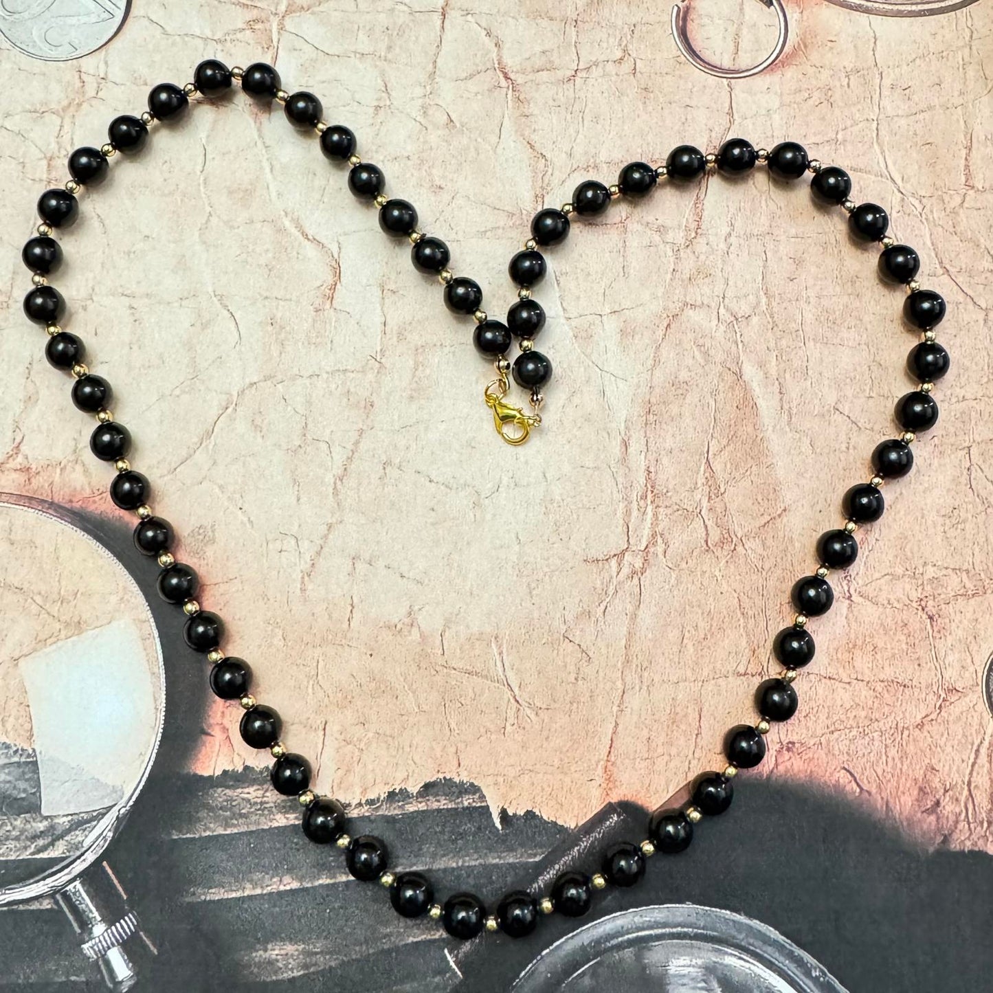 Vintage Black Glass and Gold-Tone Beaded Necklace with Coordinating Earrings