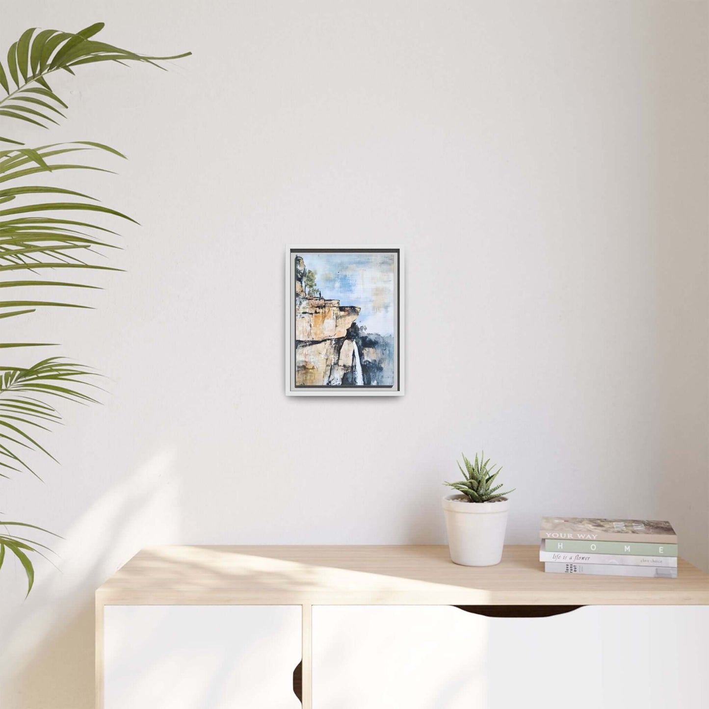 Impressionistic landscape waterfall canvas art framed on wall, creating a serene and harmonious home atmosphere.
