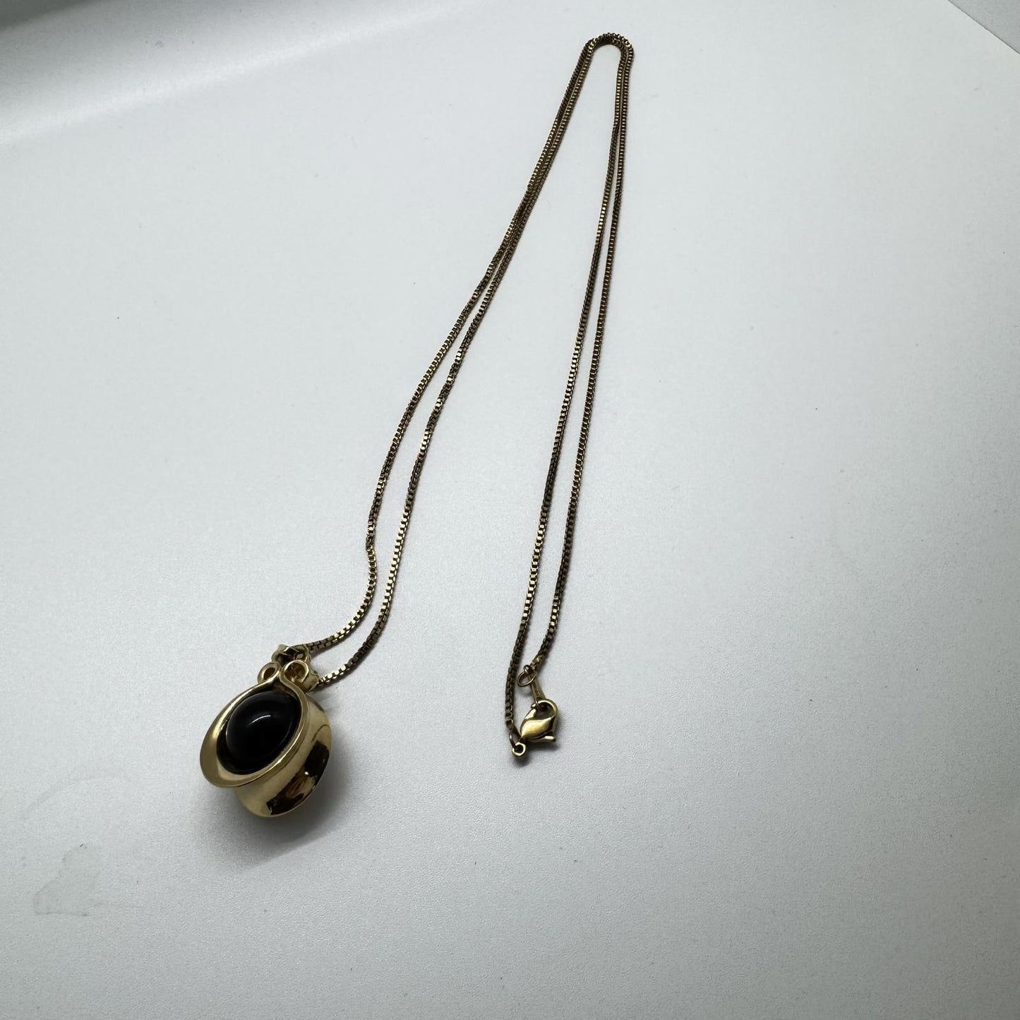 Vintage Avon Gold-Tone Flip Pendant Necklace – Black & White Reversible Stone