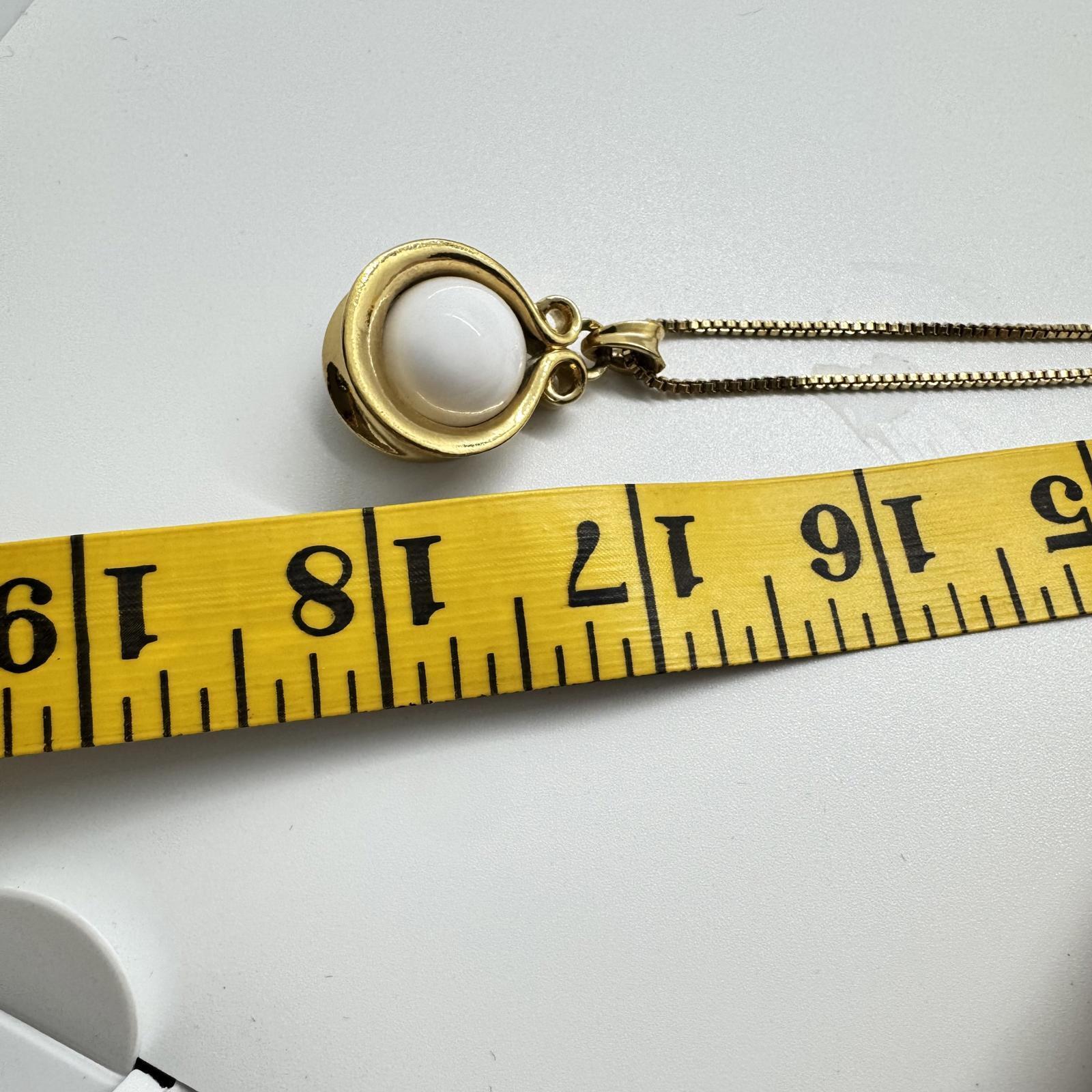 Vintage Avon Gold-Tone Flip Pendant Necklace – Black & White Reversible Stone