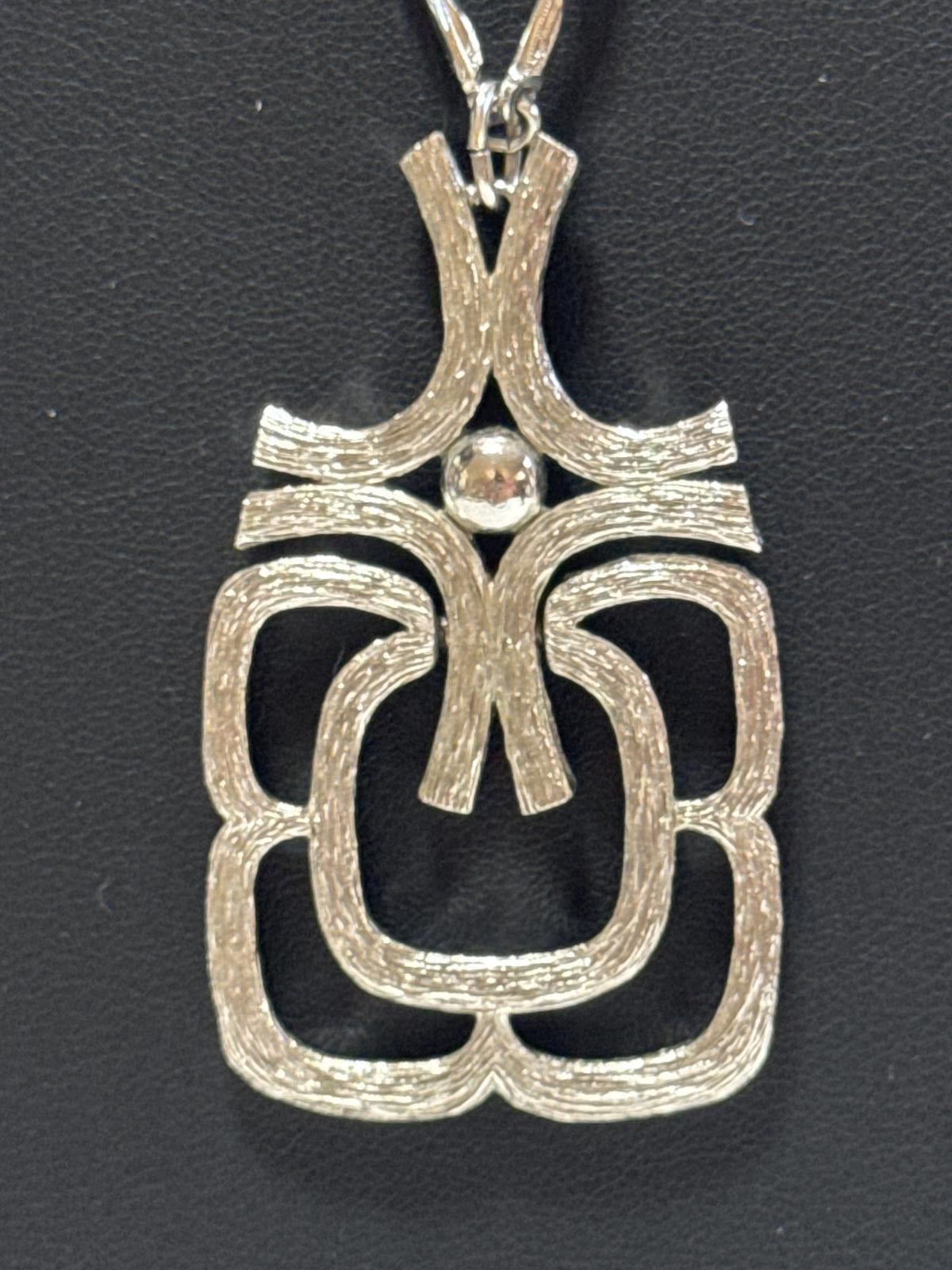 Elegant Silver -Tone Statement Necklace with Unique Design