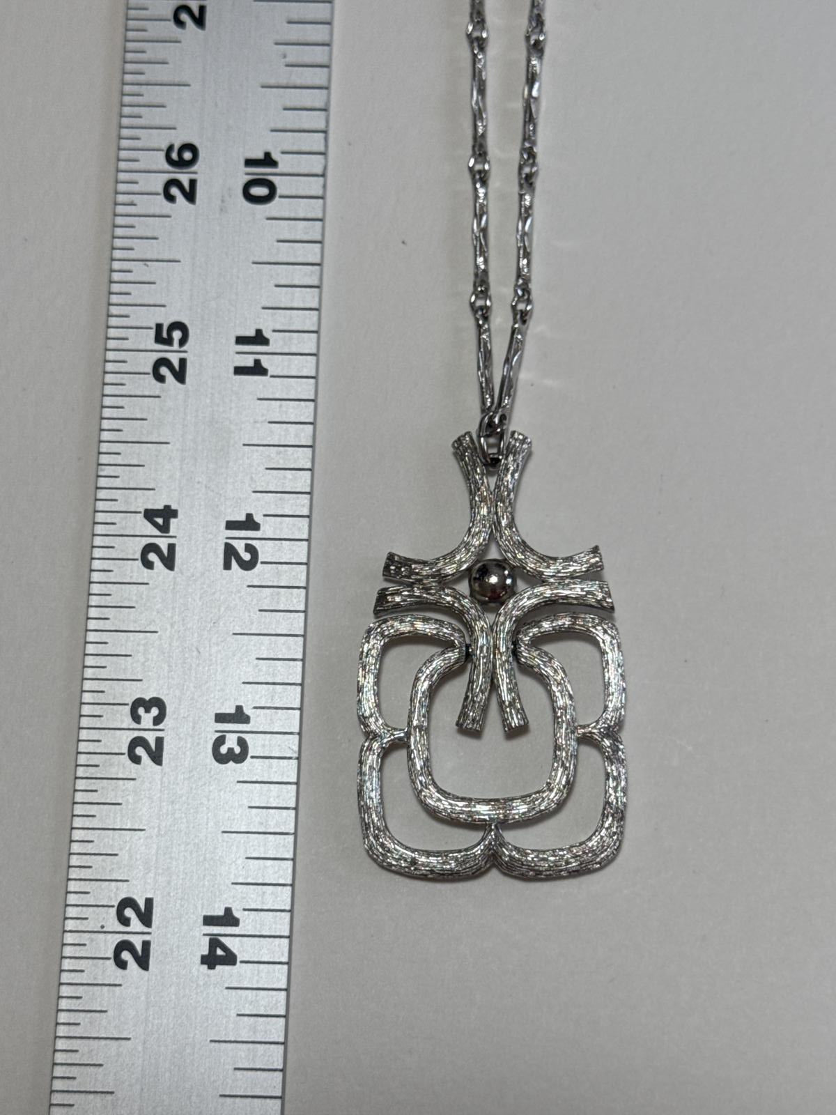 Elegant Silver -Tone Statement Necklace with Unique Design