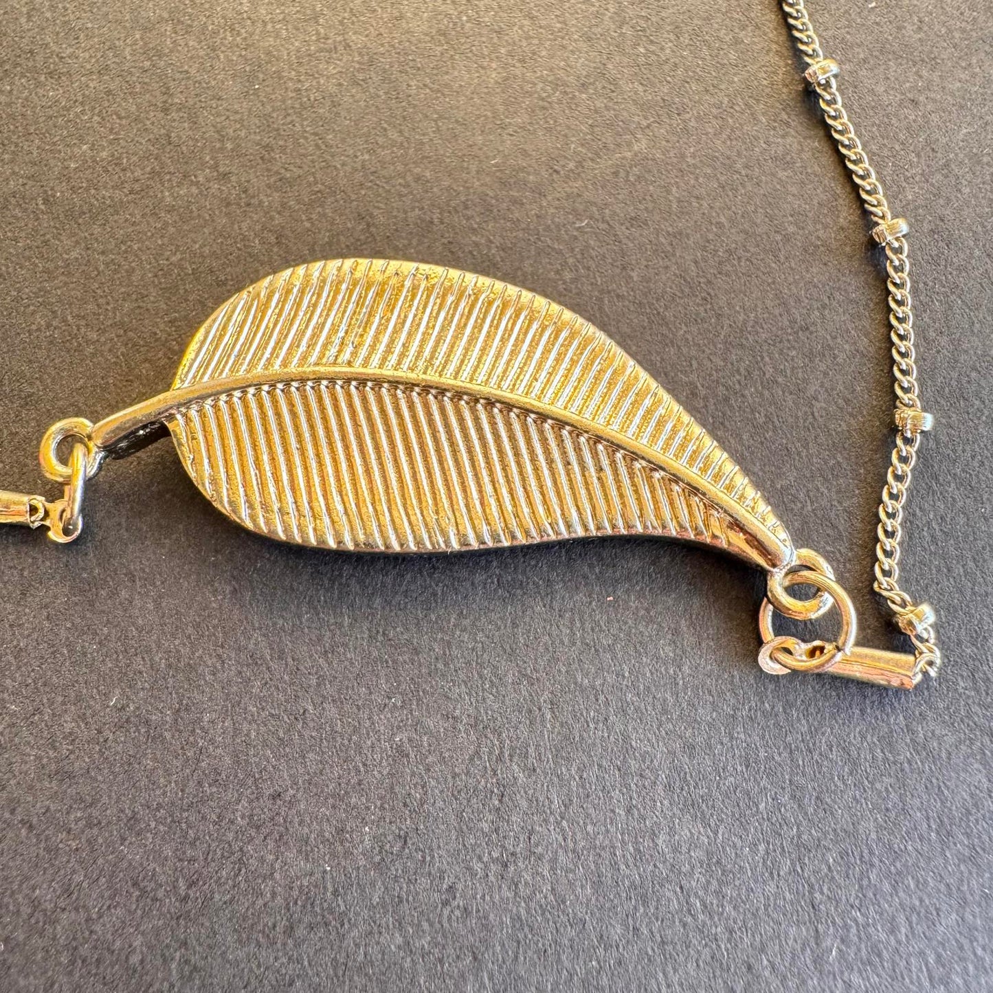 Elegant Leaf Pendant Necklace with Shimmering Stones