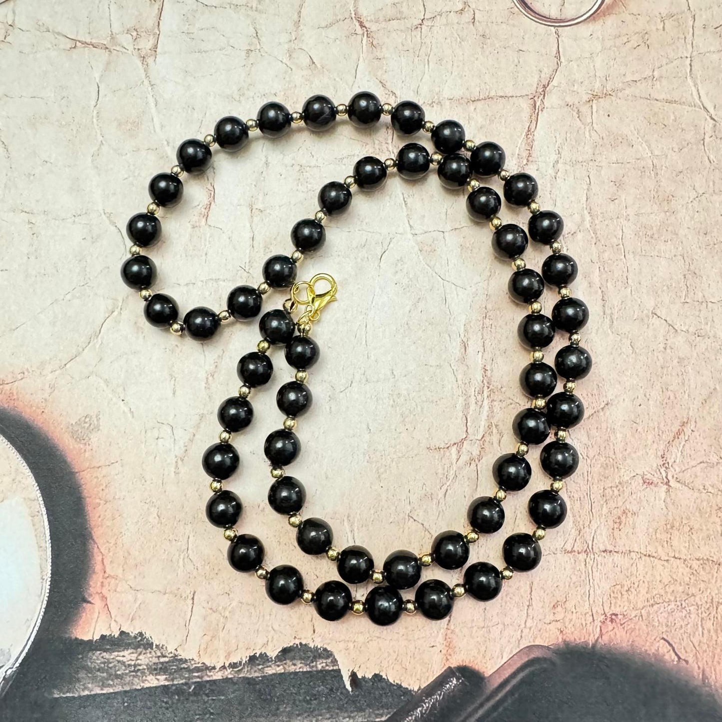 Vintage Black Glass and Gold-Tone Beaded Necklace with Coordinating Earrings